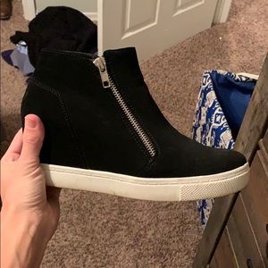 Black suede wedge tennis shoe.